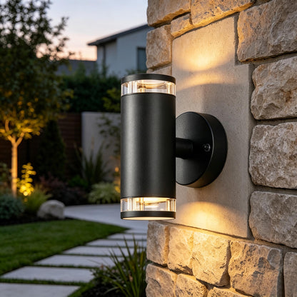 Modern anthracite outdoor wall light installed beside a front door for exterior lighting