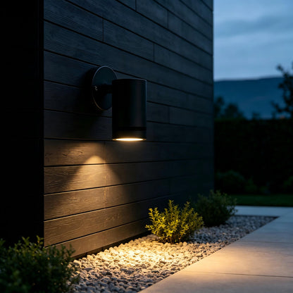 Black stainless steel wall lamp medium shot, minimalist villa courtyard daytime