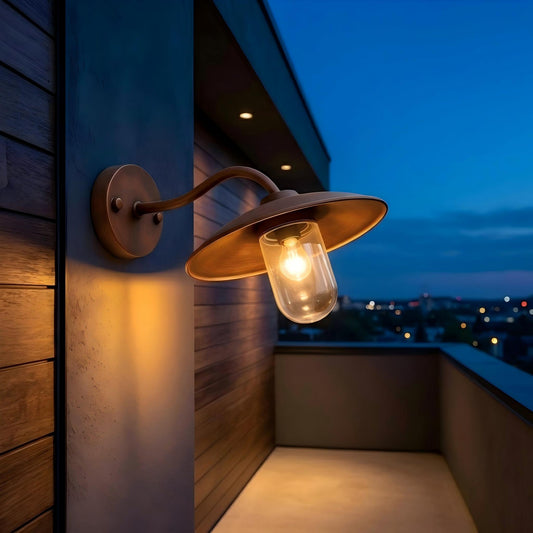 Bronze exterior wall light mounted on a modern house wall, adding stylish illumination to outdoor architectural spaces.