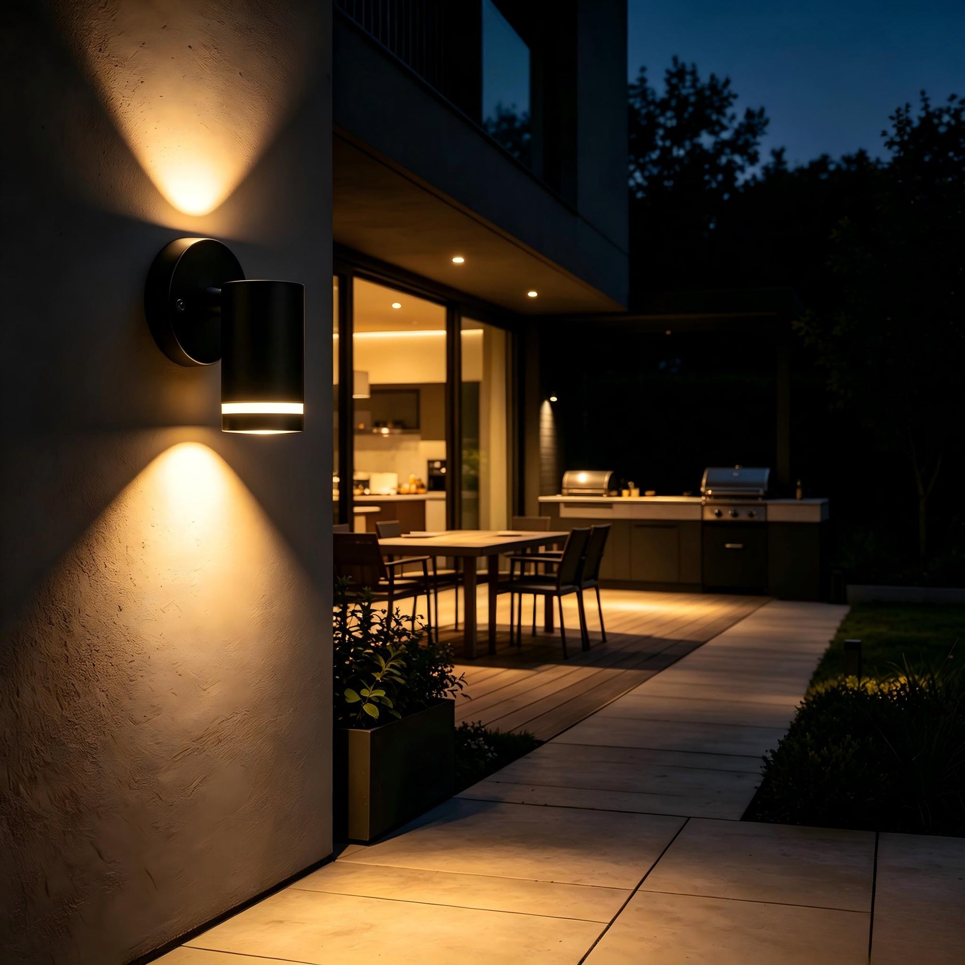 Wide shot matte black wall sconce unlit on charcoal grey modern house facade