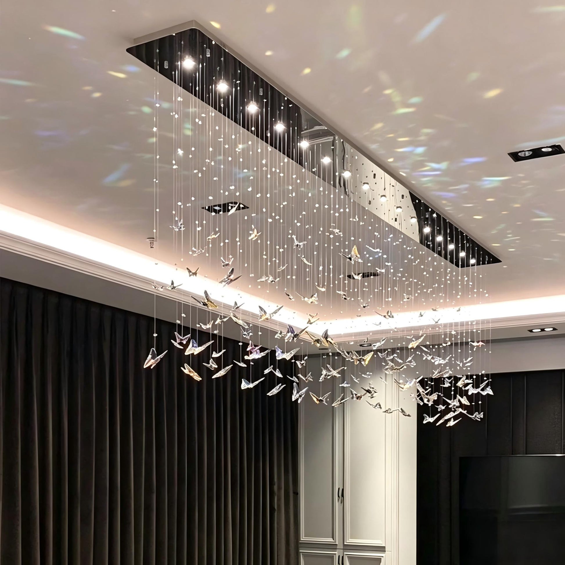 linear-crystal-chandelier-water-ripple-light-effect-luxury-dining-space
