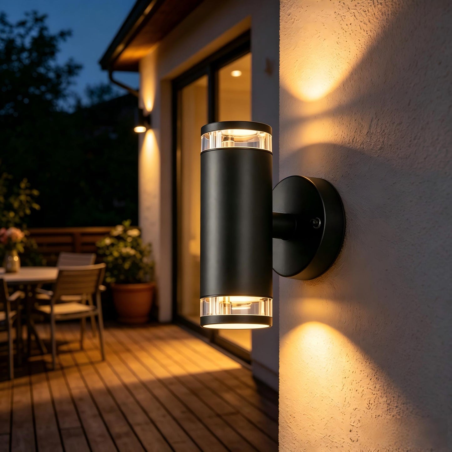 Cylindrical GU10 garden wall light illuminating an outdoor garden wall area