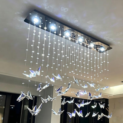 modern-crystal-pendant-light-over-white-dining-table-interior-design