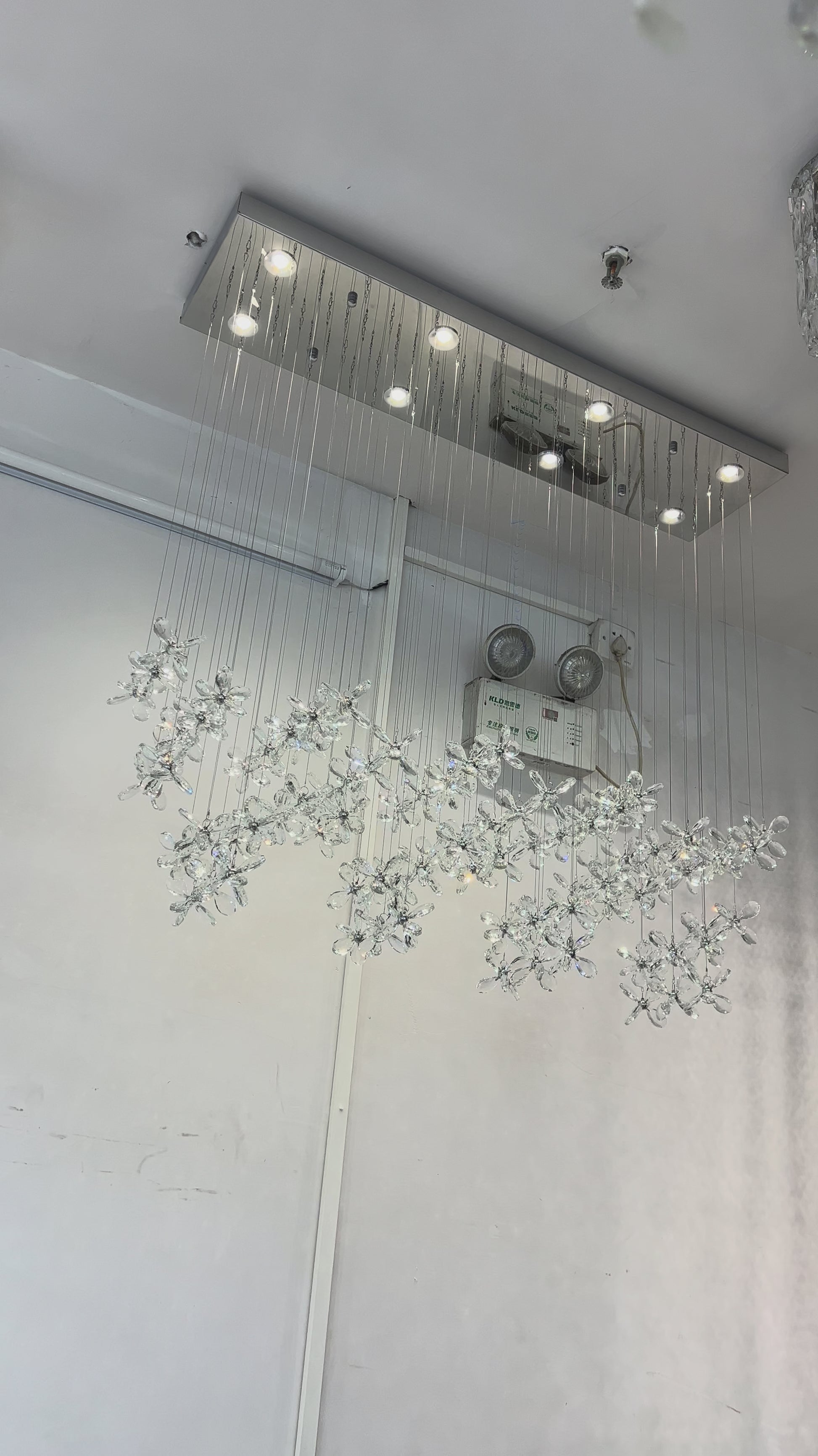 modern-linear-crystal-butterfly-chandelier-water-ripple-light-effect-detail-showcase
