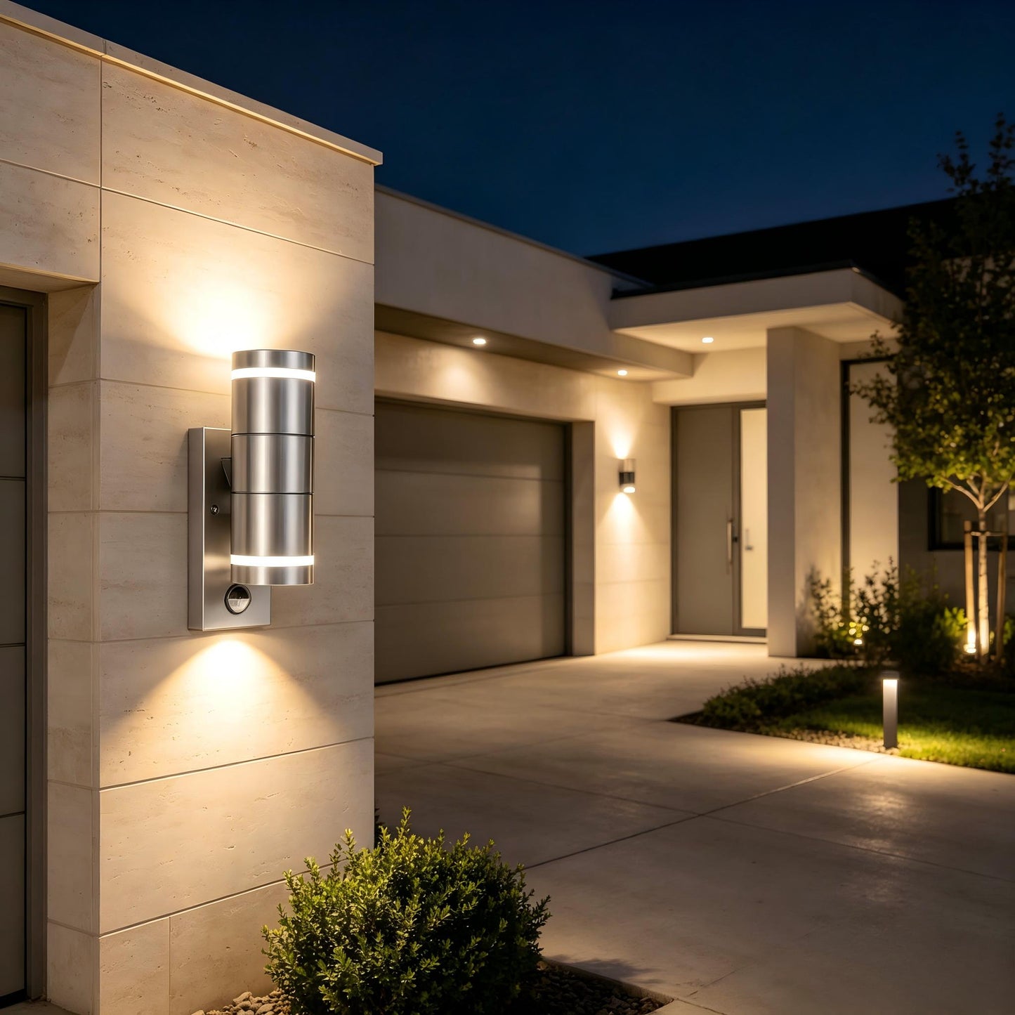 Wide view of resort hotel entrance facade with mini stainless steel motion wall lamps