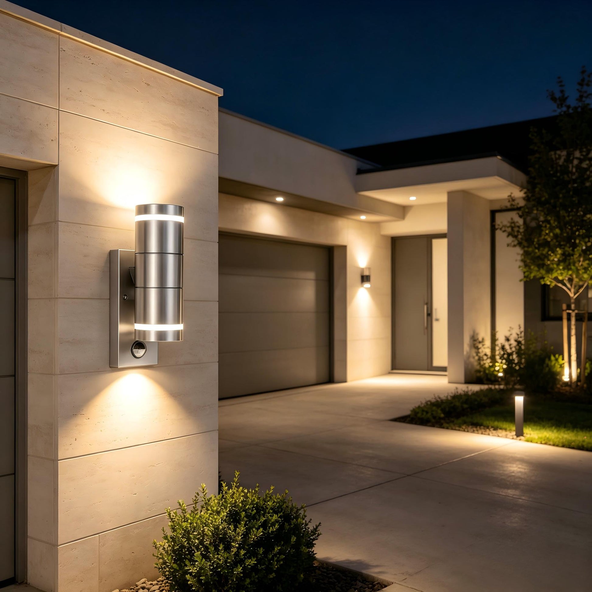 Wide view of resort hotel entrance facade with mini stainless steel motion wall lamps