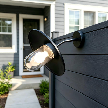 Detailed view of the clear capsule glass shade and the weatherproof seal on the Sunsatu exterior sconce.